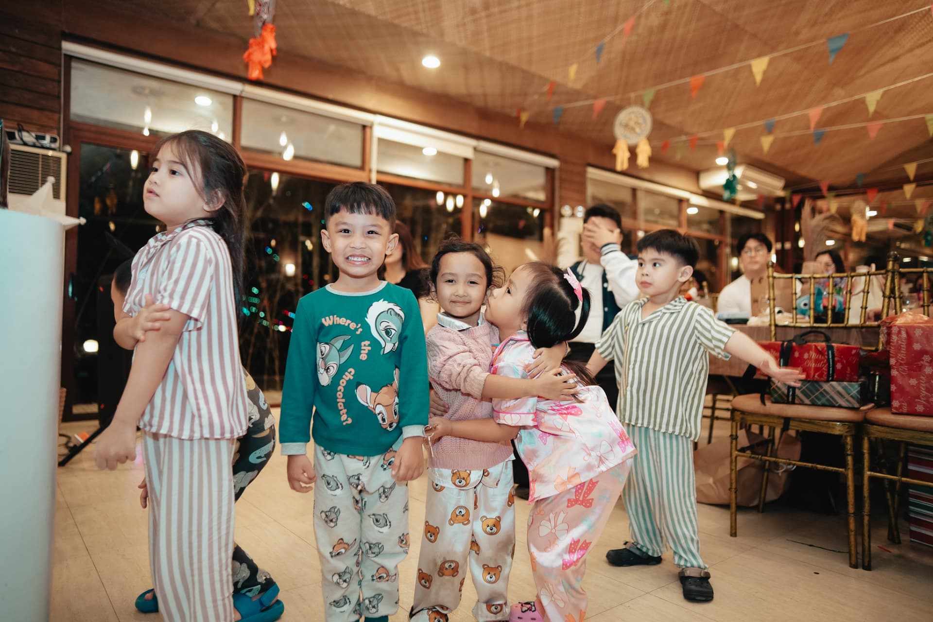 Kids in pajamas enjoying the party games
