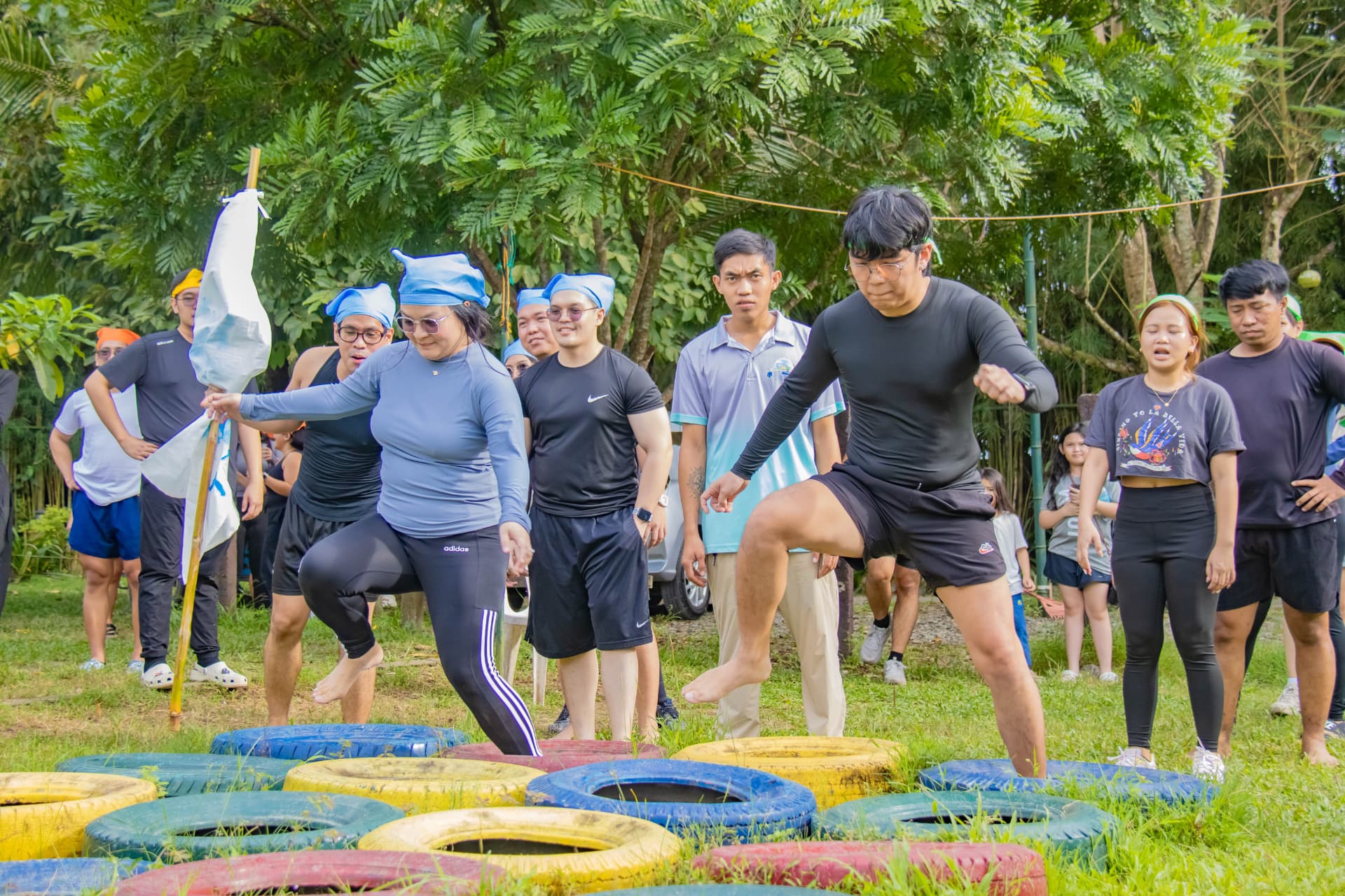 More teammates taking on the tire course